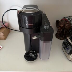 Nespresso Black Coffee Maker with Silver Accents